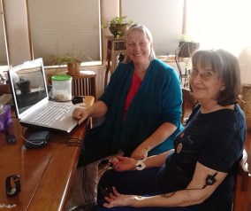 Lindsay hooked up to a computer with electrodes.